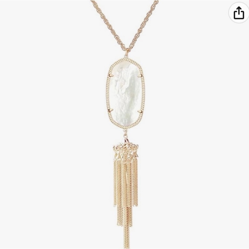 Kendra Scott Rayne necklace: Gold chain, White pendant with tassels